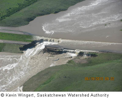 Flood waters crossing Highway #1 just west of Maple Creek, Saskatchewan  Kevin Wingert © Saskatchewan Watershed Authority 2010.