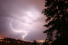 Photo of a lightning bolt in the night sky over the Kelowna forest fires. Photo: Dudley Dennis © Environment Canada, 2009