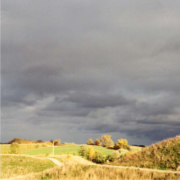 Dark-coloured stratocumulus clouds over rolling hills