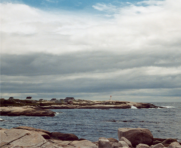 Stratocumulus clouds over a rocky shoreline