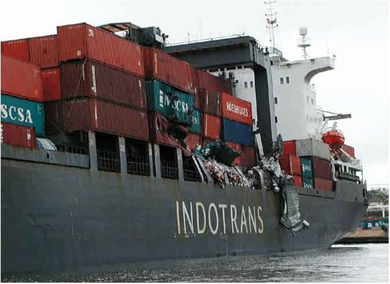 This container ship was damaged in Halifax port when it came into contact with another ship. At the height of the storm the mooring lines from one ship parted, and wind carried the ship across the berth where it came to rest against another ship. Photo: Roger Percy and Andre Laflamme