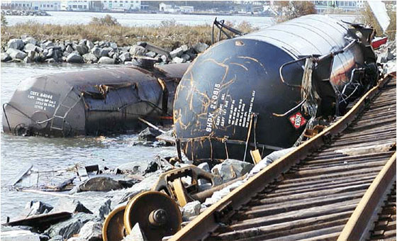 The storm surge washed out train tracks and caused these railcars to slide into Halifax Harbour. Photo: Roger Percy and Andre Laflamme